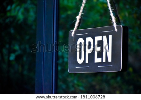 Shop open of storefront sign, restaurant shows the opening status.