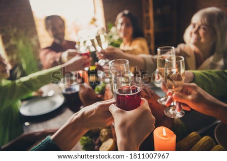 Portrait of nice attractive family sitting around served table clinking glasses celebratory good mood every year cozy festive at modern loft industrial wooden interior house apartment