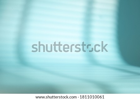 Window shade with blinds on a blue space. Abstract background fo