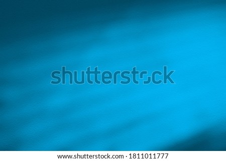 Blue Stucco Wall with Light Beam and Shadow.