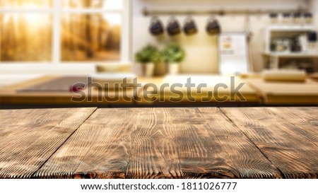 Table background of free space and autumn window in home interior 