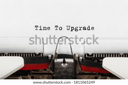 Text Time to upgrade typed on typewriter,concept