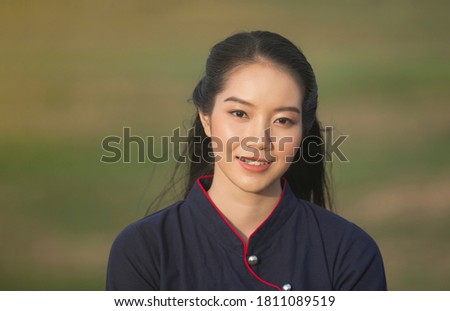  Portrait of a beautiful asian woman in countryside, Thailand.