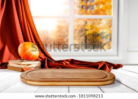 White window with autumn view of forest and desk of free space for your decoration 
