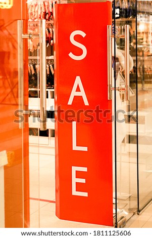 Red counter with "Sale" sign.