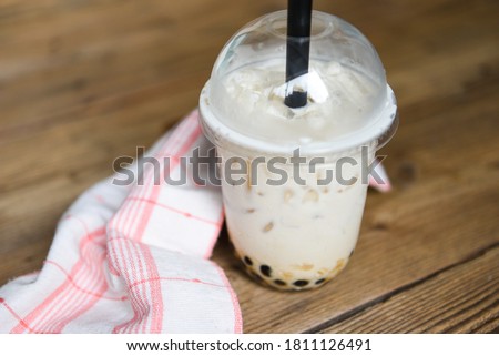 Taiwan milk tea Bubble milk tea in glass on the wooden table