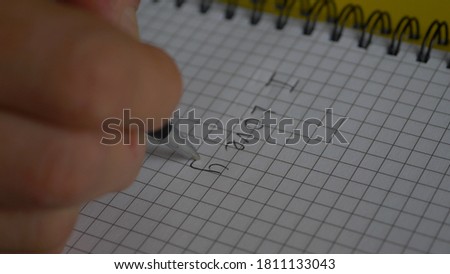 Hand writing word i love you text with pen in notebook.