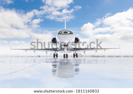 A wide shot of plane from outside with pilots ready for takeoff. Royalty-Free Stock Photo #1811160832