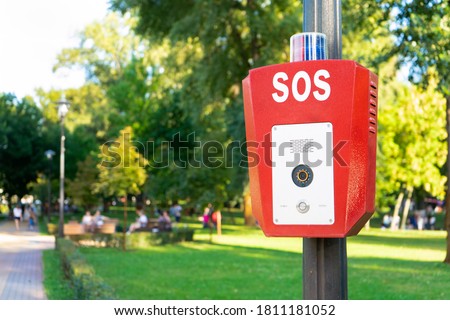 SOS, police, emergency button in the public park.