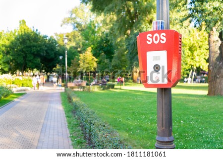 SOS, police, emergency button in the public park. Royalty-Free Stock Photo #1811181061