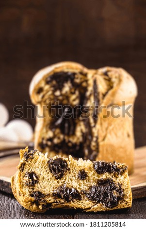 homemade chocolate panettone slice, punctual focus, typical Christmas dessert in several countries in the world like Brazil and Italy
