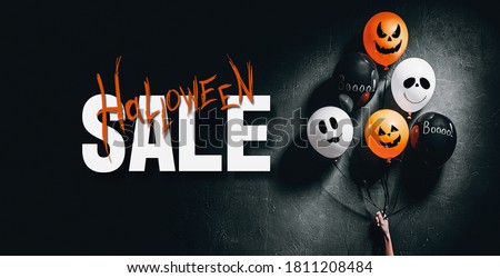 Halloween Sale special offer banner with scary air balloons for halloween over dark background