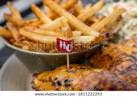 flame grilled chicken with fries
