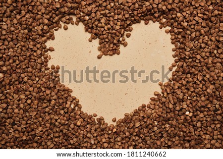 buckwheat on a backdrop. rustic buckwheat background. buckwheat heart sign for instagram.