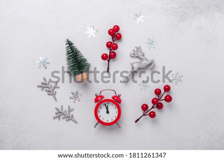 Christmas composition with alarm clock, souvenirs, candy cane, snowflakes. Christmas, winter, new year concept. Flat lay, top view, copy space - Image