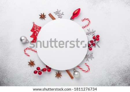 Christmas composition with red and solver gifts. White paper blank circle shape. Christmas card. Flat lay, top view, copy space - Image
