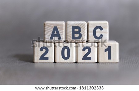 ABC text on wooden cubes on a monochrome background