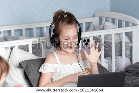 Pretty girl learning online with laptop computer at bedroom. New normal