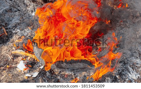Close-up of tire burning on road