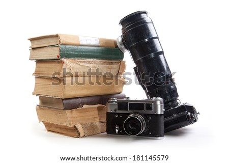 Vintage camera and old books on a white background. Isolated