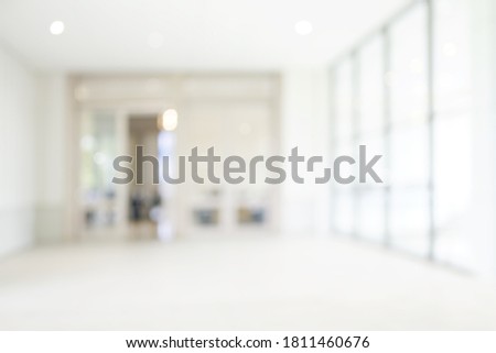 Blur background with glsss door inside building gray tone. interior lobby room in hotel. Royalty-Free Stock Photo #1811460676