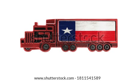 Toy truck with State of Texas flag shown isolated on white background. The concept of cargo transportation between countries.