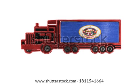 Toy truck with State of Minnesota flag shown isolated on white background. The concept of cargo transportation between countries.