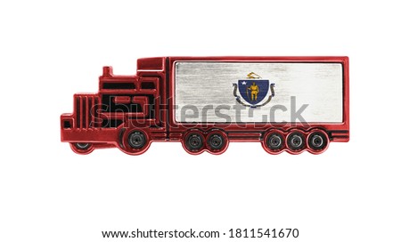 Toy truck with State of Massachusetts flag shown isolated on white background. The concept of cargo transportation between countries.