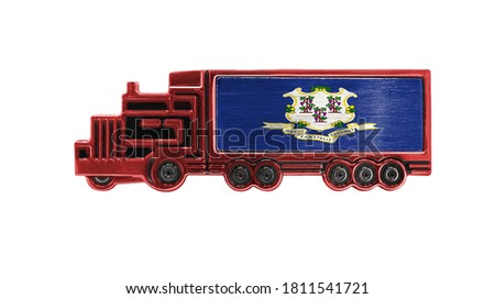 Toy truck with State of Connecticut flag shown isolated on white background. The concept of cargo transportation between countries.