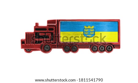 Toy truck with Lower Austria flag shown isolated on white background. The concept of cargo transportation between countries.