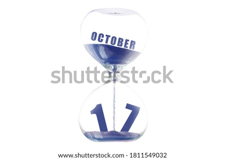 october 17th. Day 17 of month, Hour glass and calendar concept. Sand glass on white background with calendar month and date. schedule and deadline autumn month, day of the year concept.