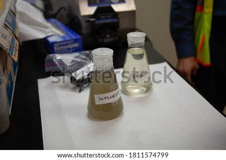 Modern urban wastewater treatment plant. Water purification is the process of removing undesirable chemicals, suspended solids and gases from contaminated water. Water cleaning facility outdoors. Royalty-Free Stock Photo #1811574799