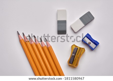 pencils, pencil sharpener, eraser on a white background