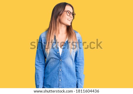 Beautiful caucasian woman wearing casual clothes and glasses thinking concentrated about doubt with finger on chin and looking up wondering 