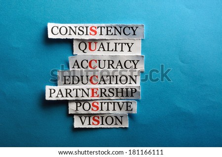 Success acronym in business concept, words on cut paper hard light 