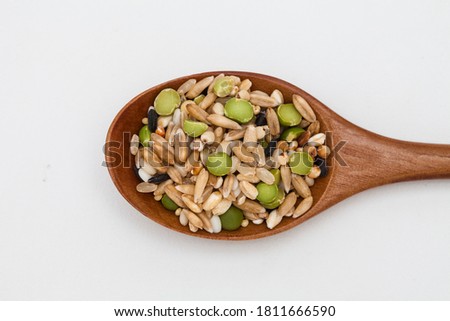Wooden spoon with Miscellaneous grains
 Royalty-Free Stock Photo #1811666590