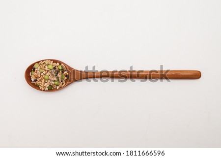 Wooden spoon with Miscellaneous grains
 Royalty-Free Stock Photo #1811666596