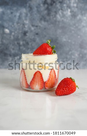 a cup of strawberry magnolia dessert  
