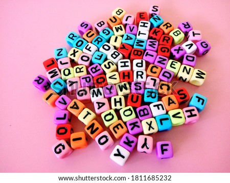 variety block alphabet on pink background