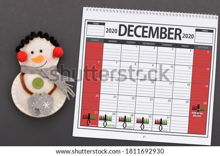 Kwanzaa December 2020 Calendar with Snowman on black background