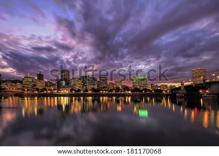 Portland Oregon Downtown Waterfront City Skyline with Reflection on Willamette River After Sunset