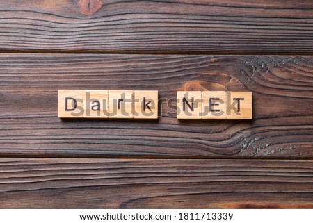 dark net word written on wood block. dark net text on cement table for your desing, concept.