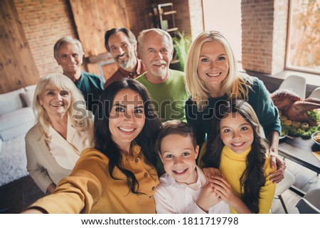 Closeup portrait photo of full family gathering eight people cuddle embrace hold hands finish dinner make shoot selfie memorable lovely picture generation in home evening living room indoors