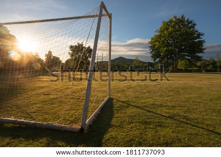 soccer goal with sun beam in the morning light Royalty-Free Stock Photo #1811737093