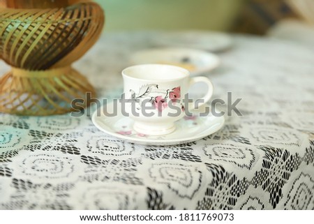 Close up white coffee cup or tea cup on table with background blur selective focus.