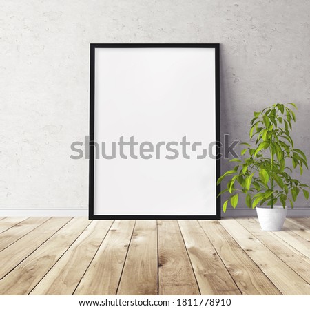 Blank vertical big poster with black frame standing on floor. Mockup template for you design.