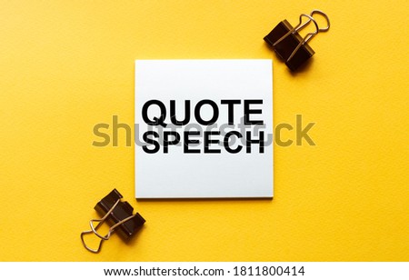 white paper with text quote speech on a yellow background with stationery