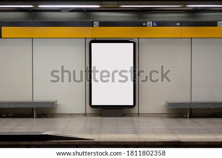 Blank billboard mock up in a subway station, underground Royalty-Free Stock Photo #1811802358