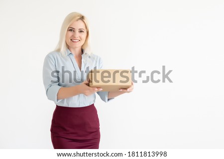 Moving House, Moving Office and holding a box. woman with box