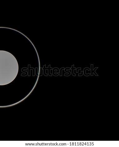 White glowing circles on a black background. 